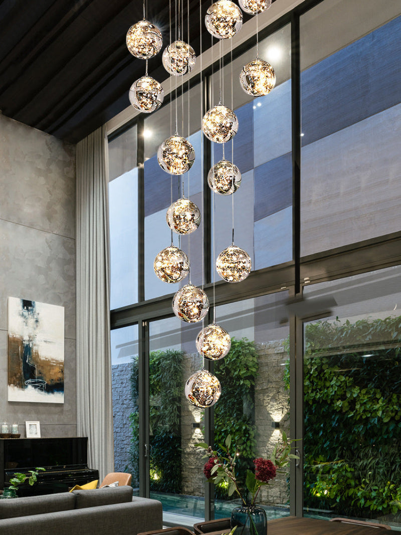 Glass bubble ball chandelier with firefly-inspired design creating poetic light movement for modern staircase foyer entryway