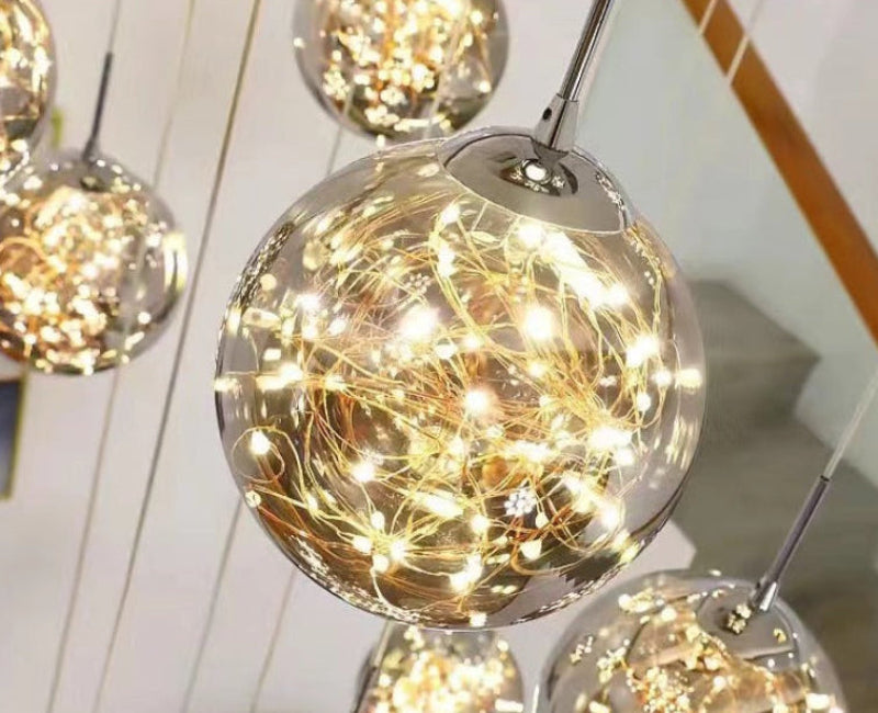 Modern foyer chandelier featuring glass bubble balls with adjustable arrangement for contemporary staircase entryway high ceiling