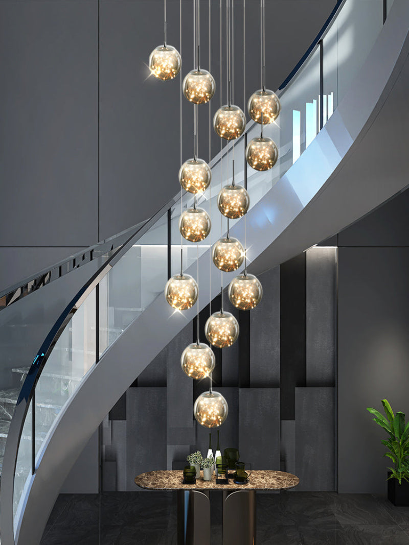 Smoky grey glass bubble chandelier with firefly movement creating dramatic effect for modern staircase foyer entryway high ceiling