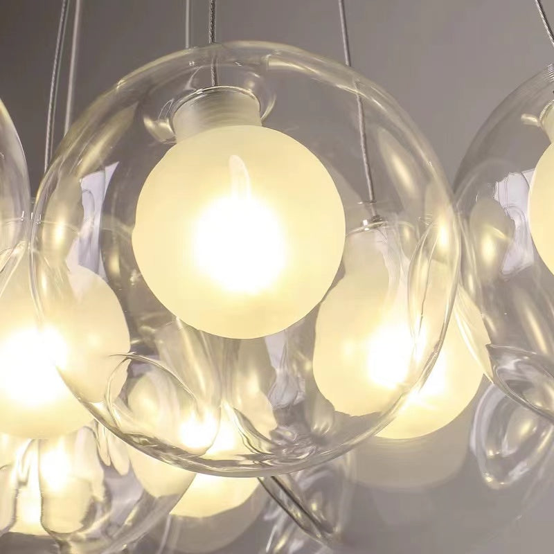 Chrome bubble glass fixture with cool white LED creating crisp clarity for contemporary living room dining room staircase