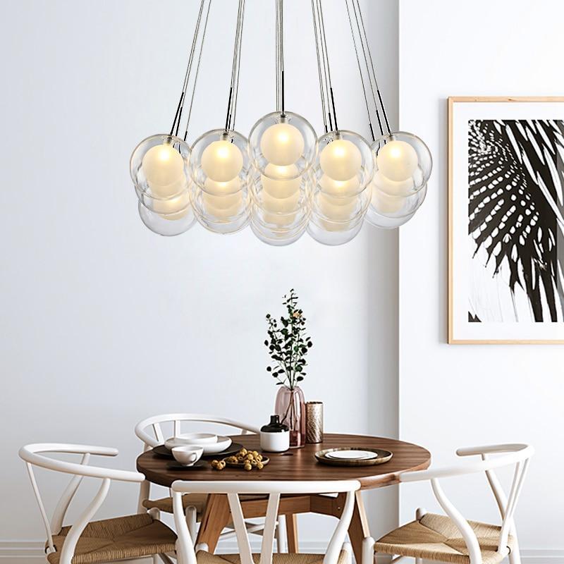 Glass bubble chandelier with modular construction creating understated elegance for modern living room dining room staircase