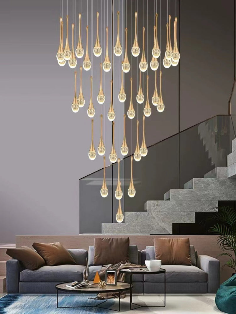 Gold modern crystal teardrop chandelier featuring Golden Tears solid crystal with internal bubble effects for foyer staircase entryway lighting
