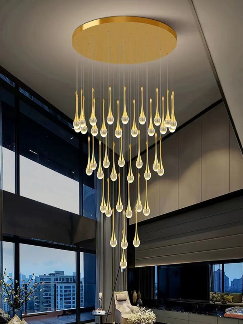Gold crystal teardrop chandelier featuring Golden Tears solid crystal with internal bubble effects for staircase foyer entryway high ceiling