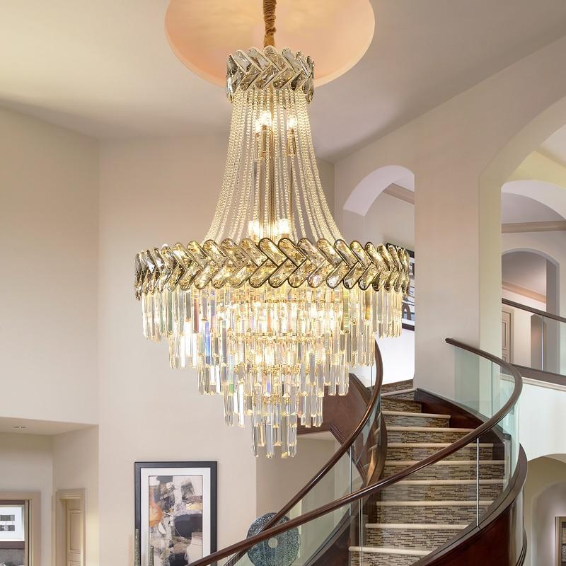 A luxurious Grand Chevron Crystal Chandelier with black tinted chevrons and sparkling high quality K9 crystals, installed in a room with modern decor.