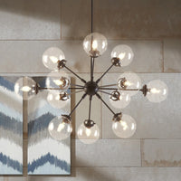 Thumbnail for Retro futuristic sputnik chandelier with orb center and starburst array creating industrial flair for dining room kitchen island