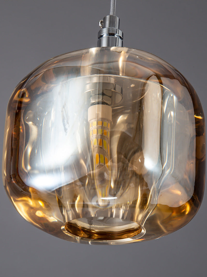 
Suspended amber-colored spiral crystal chandelier, a square glass pendant light, suitable for lighting stairwells, foyers, and entrances with high ceilings.