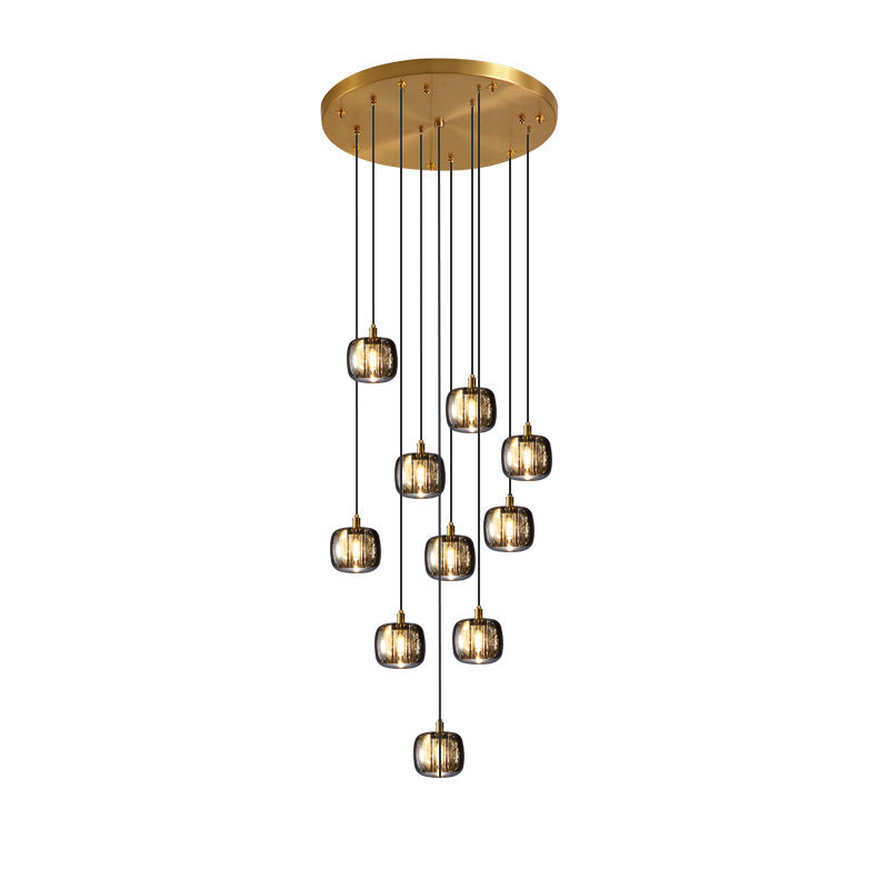 Gold-plated, randomly arranged staircase chandelier with a square K9 crystal spiral design, suitable for high-ceilinged entrance halls and foyers.