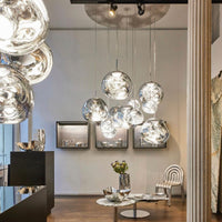 Thumbnail for Modern interior with hanging glass pendant lights in a stylish room.