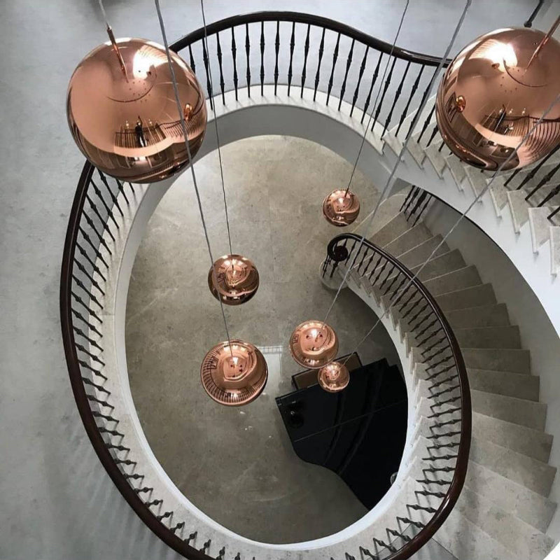 Modern lava bubble pendant light, featuring a molten glass design, suitable for modern lighting in spaces such as staircases and foyers.  Adjustable suspension cable.