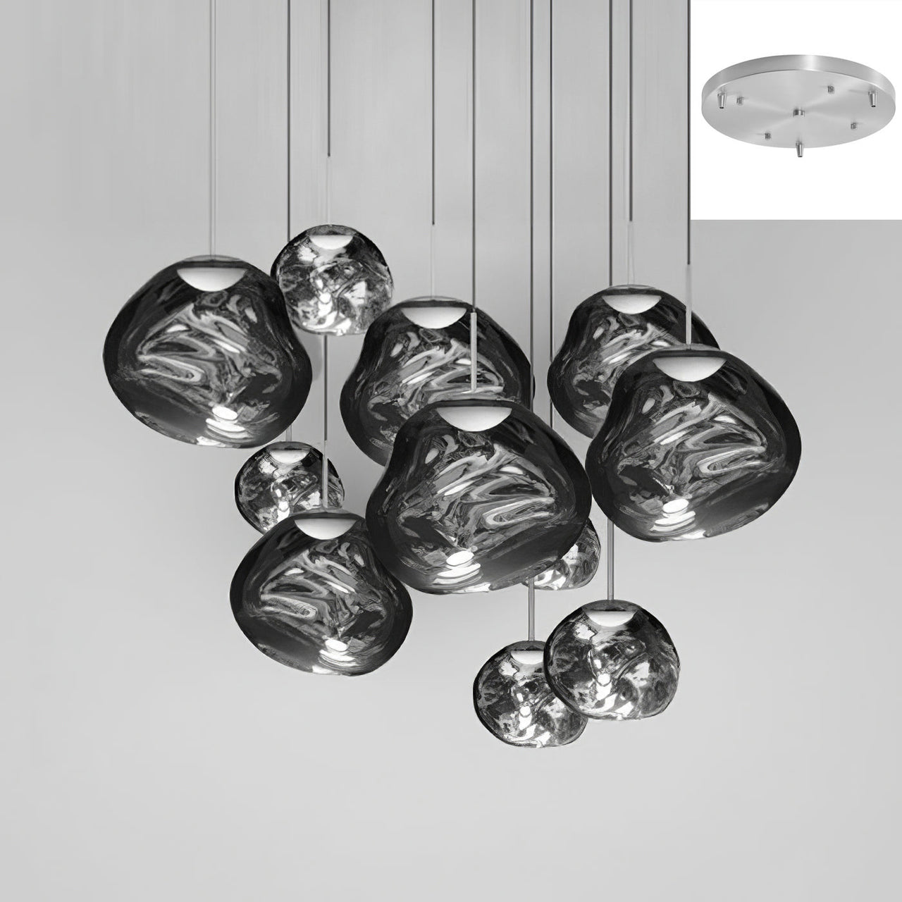 Eleven smoke-gray glass pendant lights with a molten lava and bubble design, suitable for lighting staircases, living rooms, and foyers.