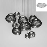 Thumbnail for Eleven smoke-gray glass pendant lights with a molten lava and bubble design, suitable for lighting staircases, living rooms, and foyers.