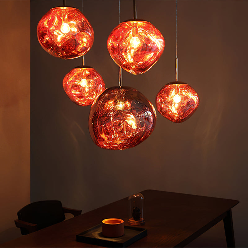 Red lava bubble pendant light, featuring a molten glass design, suitable for modern lighting in spaces such as dining rooms, kitchen islands, and entryways.