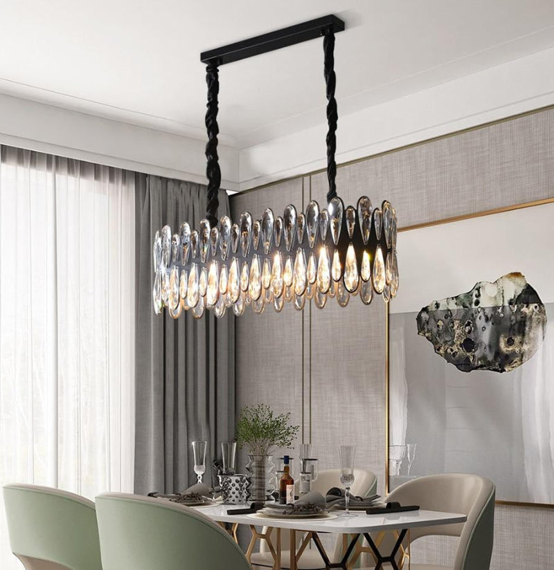 Elegant Mimis' Mystery chandelier with sleek K9 crystals creating sophisticated atmosphere for dining room living room restaurant