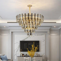 Thumbnail for A luxurious modern chandelier with clear and smoky grey crystals, hanging in a spacious room with a high ceiling, marble walls, and a flat ceiling type.