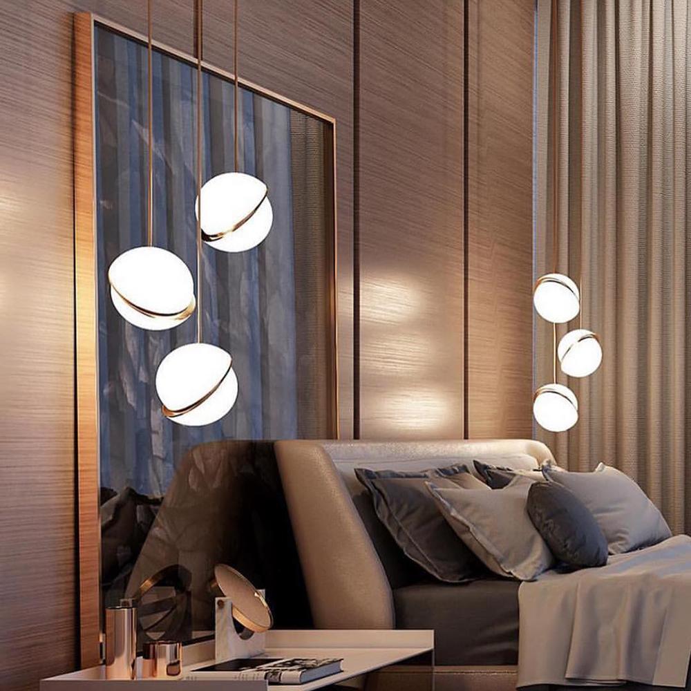 Moon Hemisphere opal sphere crescent chandelier with lunar design creating celestial lighting for dining room foyer high ceiling