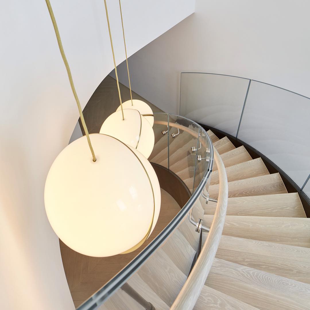 Celestial Moon Hemisphere opal sphere crescent chandelier creating moon-inspired lighting for contemporary dining room entryway