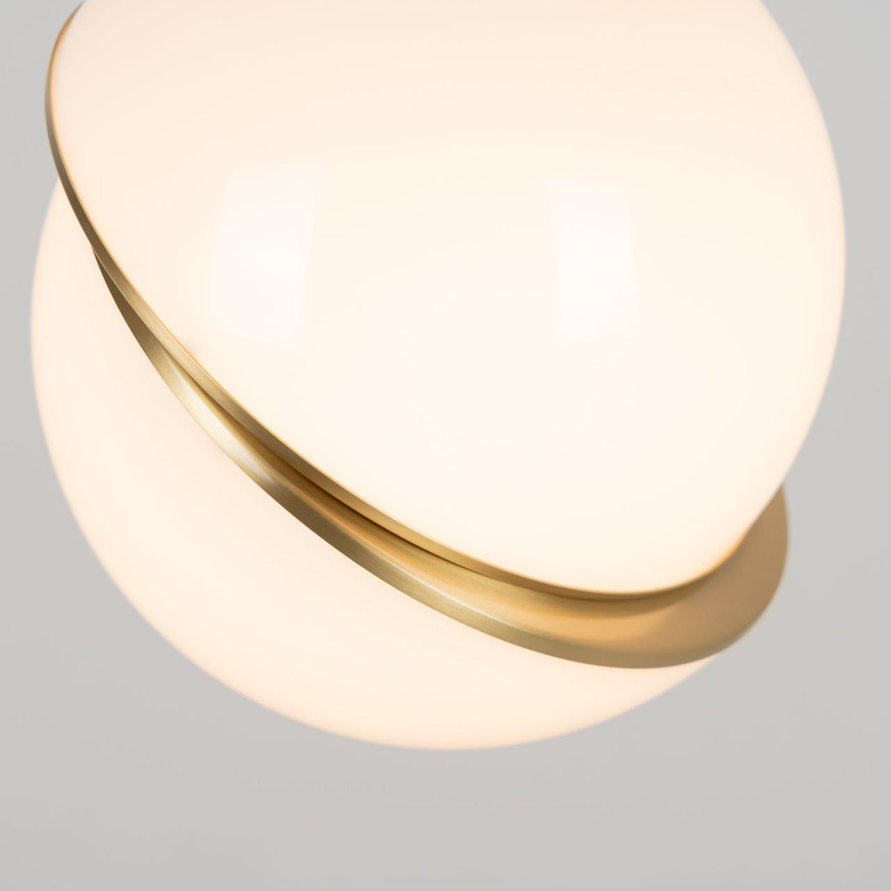 Lunar Moon Hemisphere chandelier with opal sphere crescent creating dramatic celestial lighting for modern dining room foyer