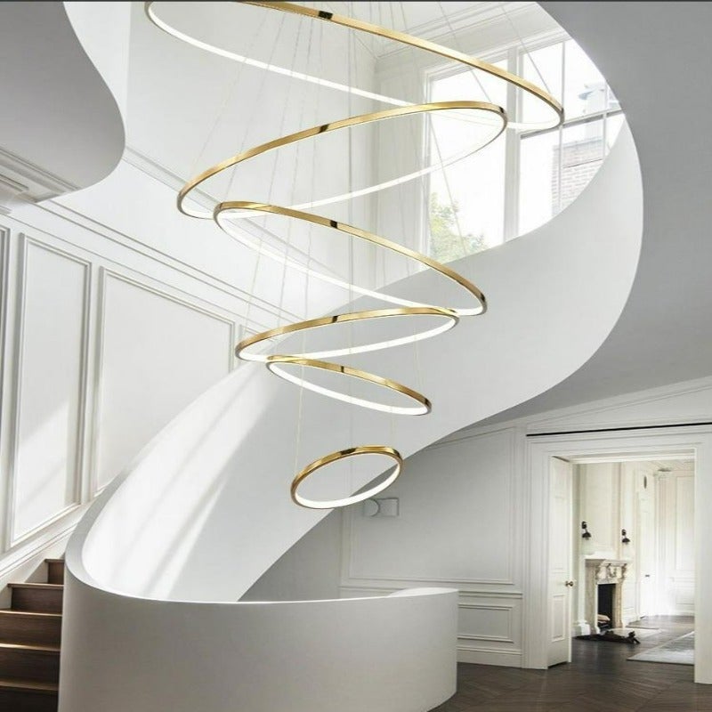 Round modern chandelier featuring Multi-Ring Luxury stainless steel design with circular arrangement for contemporary dining room foyer