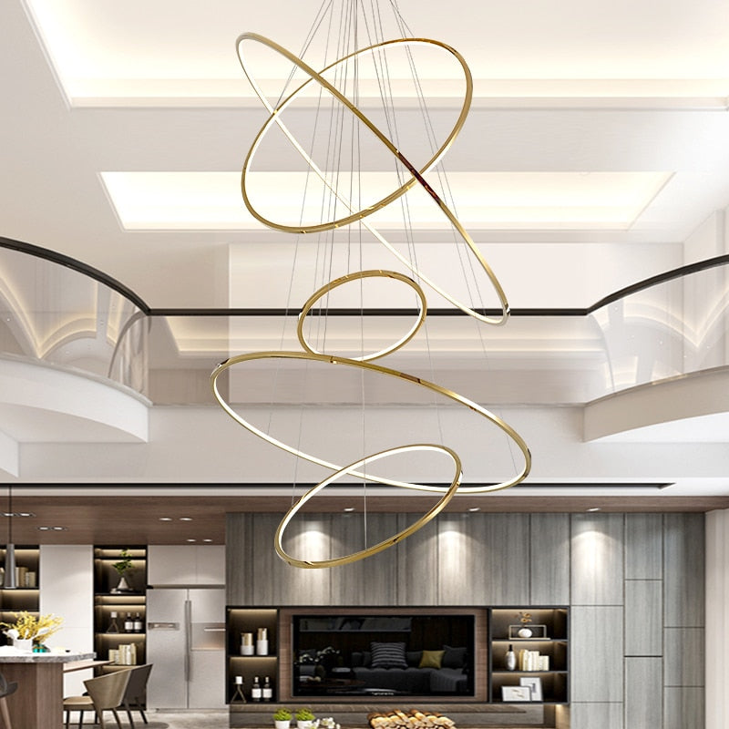 Luxury multi-ring chandelier with modern stainless steel finish creating sophisticated lighting for dining room entryway high ceiling
