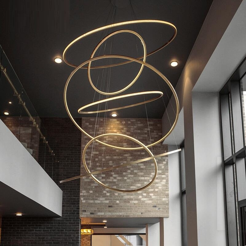 Multi-Ring Luxury modern stainless steel chandelier with circular design creating elegant lighting for dining room foyer high ceiling