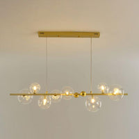 Thumbnail for Gold pendant light fixture with multiple glass bulbs on a plain background