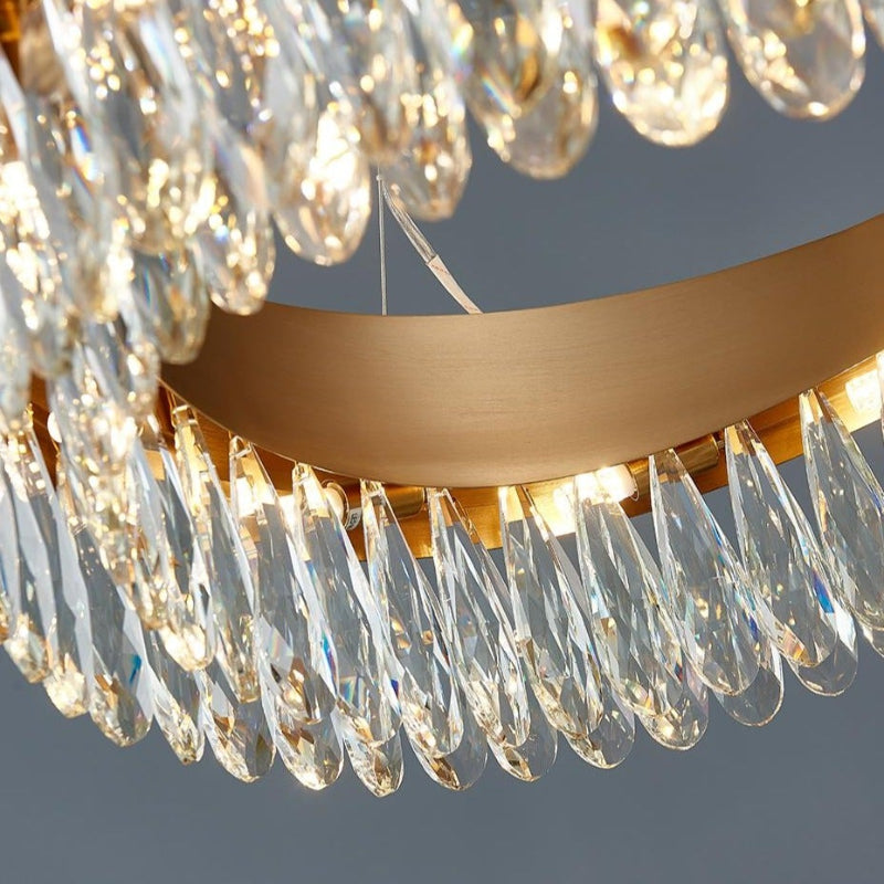 Close-up gold oval crystal chandelier with K9 teardrop crystals, modern flush mount design