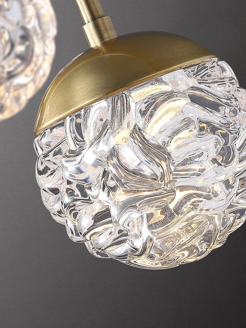 Bronze pineapple chandelier with bubble glass lights creating warm home experience for elegant foyer staircase living room