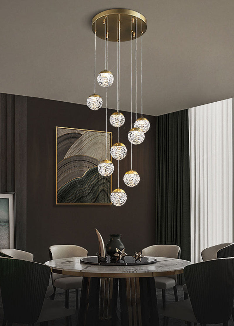 Glass bubble chandelier with pineapple-inspired cascading design creating mesmerizing light for grand foyer staircase hotel lobby