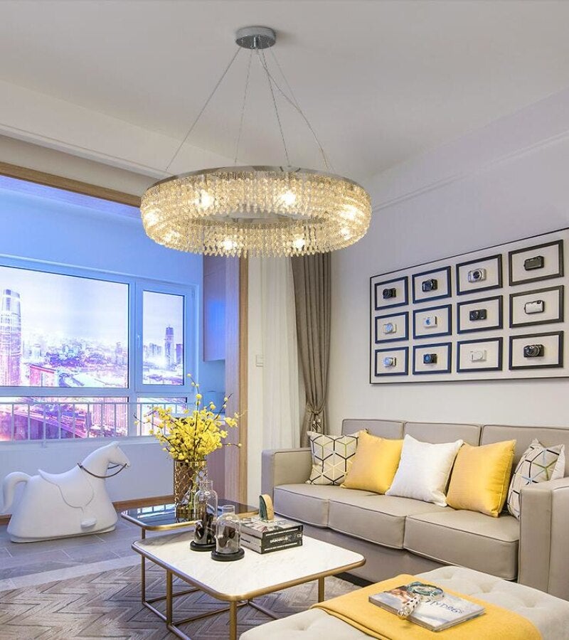 Modern K9 crystal ring chandelier with silver finish creating stunning visual centerpiece for contemporary living room dining room