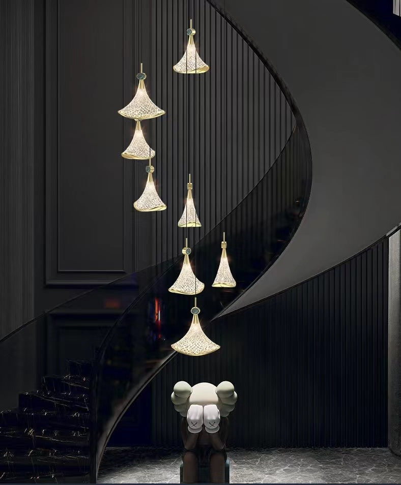 Modern chandelier lighting with Shell Cascade stainless steel design creating sophisticated lighting for staircase foyer entryway