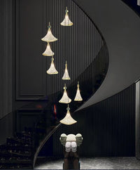 Thumbnail for Modern chandelier lighting with Shell Cascade stainless steel design creating sophisticated lighting for staircase foyer entryway