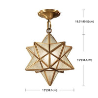 Thumbnail for Clear glass star pendant with brass metal and down lighting creating bright focused illumination for kitchen entryway dining room
