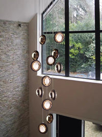 Thumbnail for Crystal chandelier lighting with Star Light Bubbles design creating sophisticated lighting for staircase foyer high ceiling